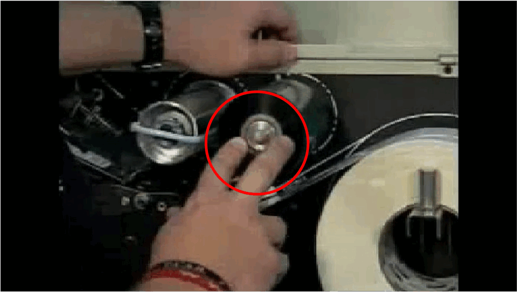 Frame from a training video showing an operator changing a ribbon on a Zebra barcode printer